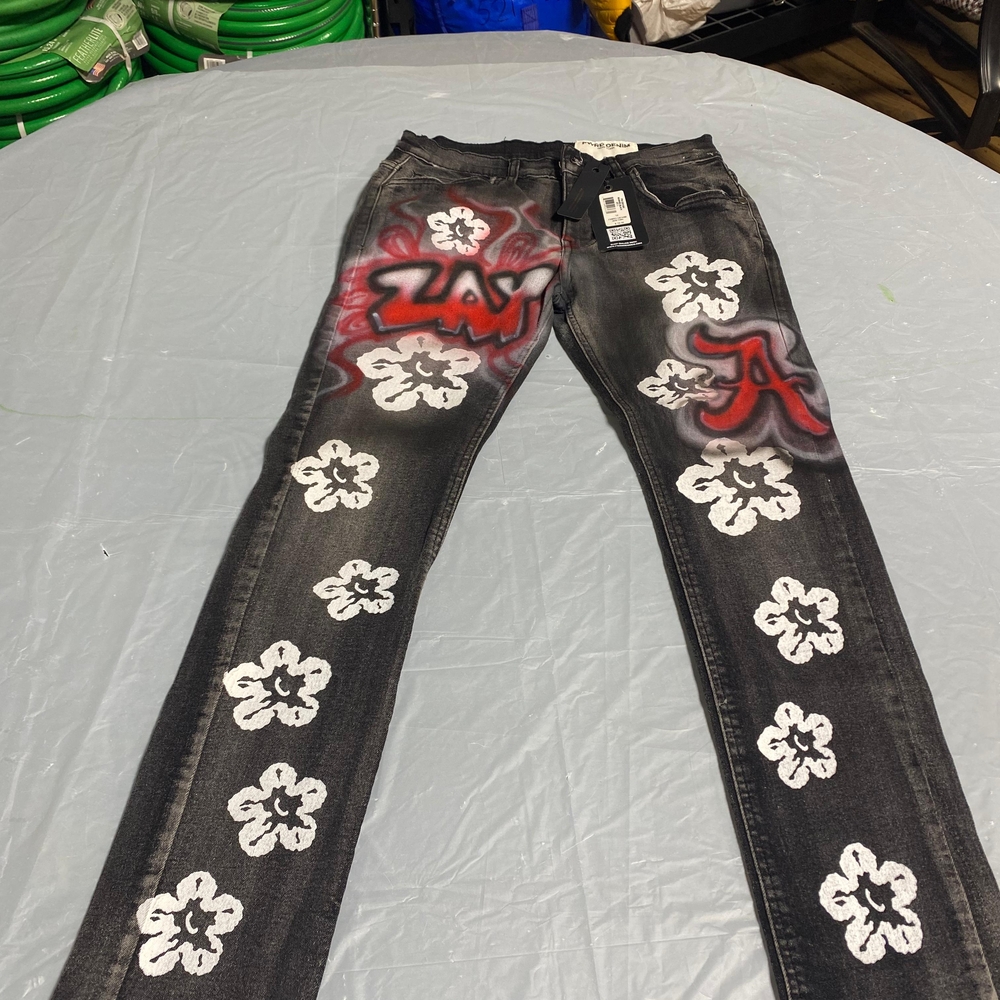 Graffiti Style Black Jeans with White Floral Design